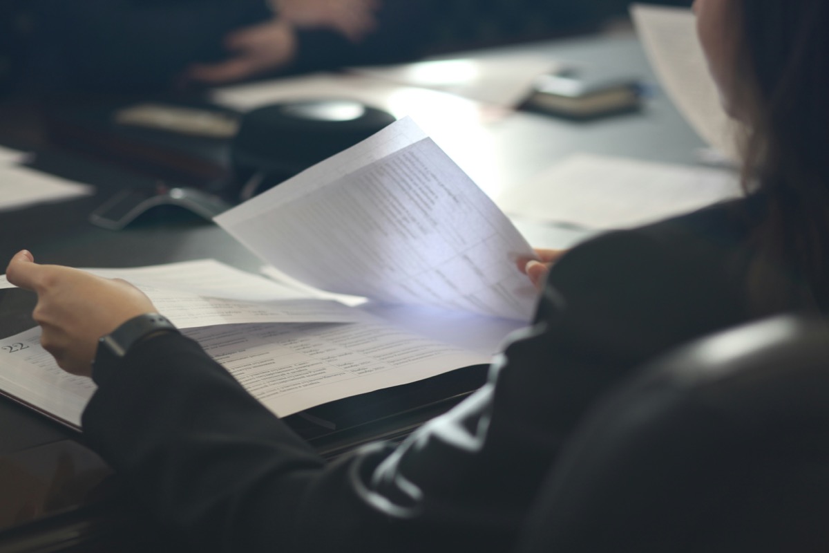 Attorney and client reviewing engagement paperwork together