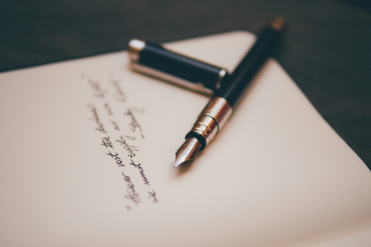 Pen resting on a signed page